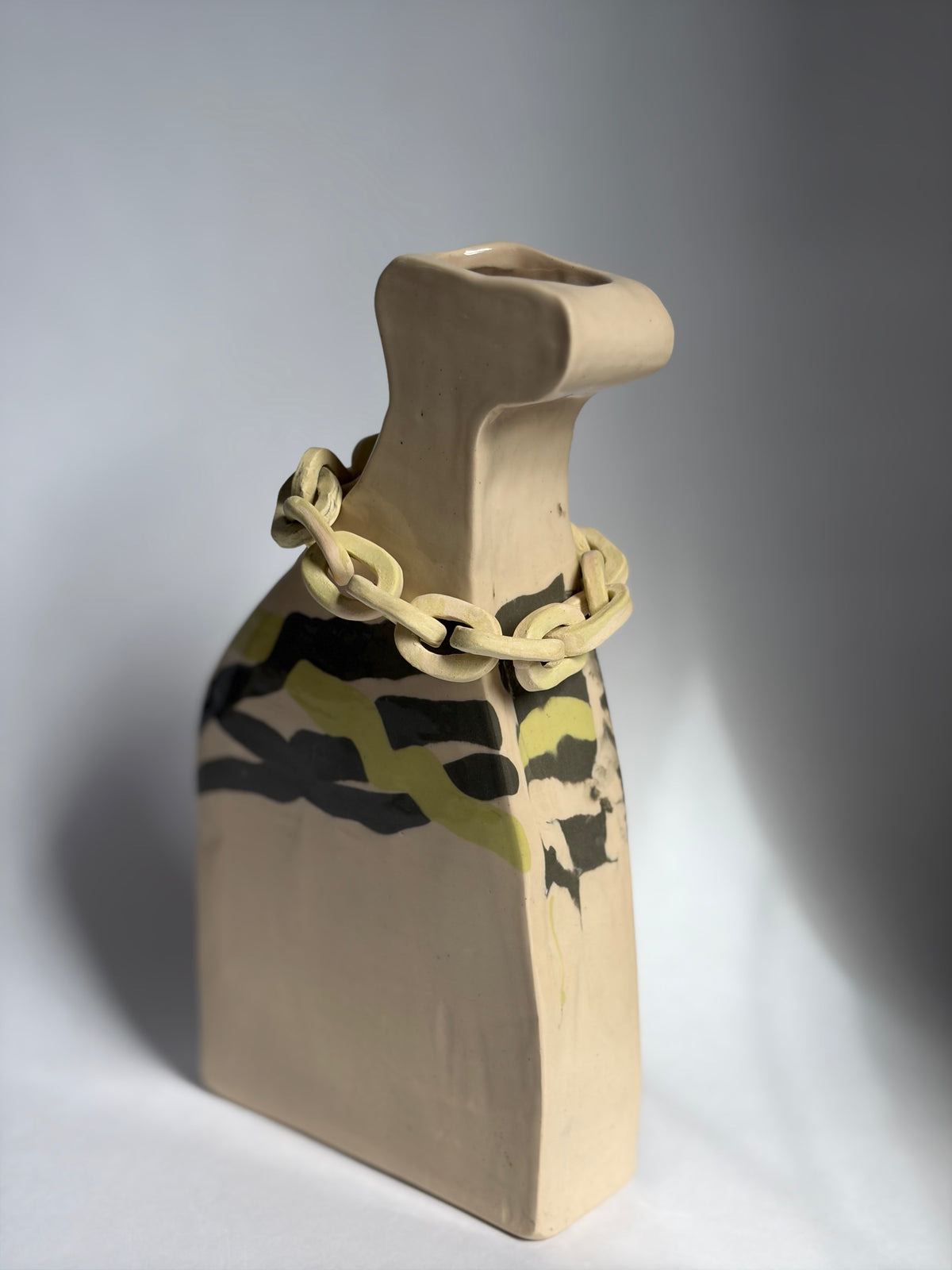 A structural vase with nerikomi marbling and a chain-link collar