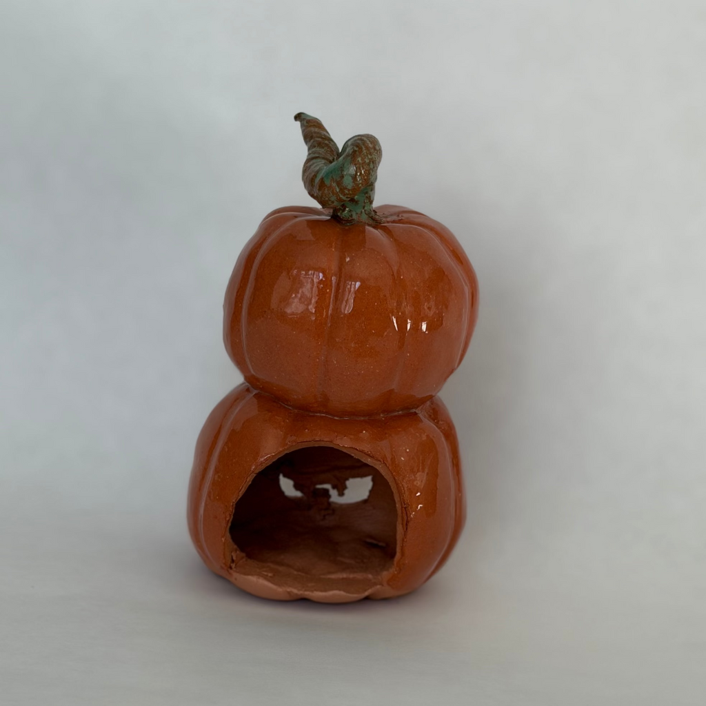 back view of A stacked pair of joined jack-o-lantern figurines